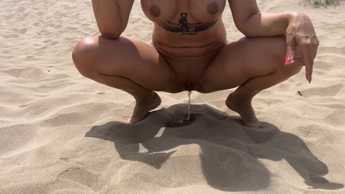 She walks completely naked on the street and on the beach